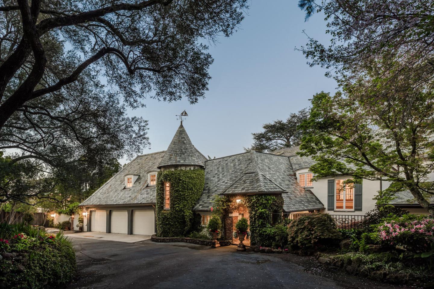 Situated on a private side street, this grand estate sits on a majestic 2-acres with jaw-dropping panoramic bay views, some of the best in all of Hillsborough. Exquisite architectural detailing and finishes throughout, including inlaid parquet walnut floors, hand carved fireplaces, and walls of glass framing iconic bay views and landscaping. The main level includes a stunning office, billiard hall, and the "Morocco Room" lounge. Upstairs, the large master suite enjoys equally stunning views of the bay, in addition to a luxury spa bath and formal sitting room. A separate in-law suite and wine cellar with tasting room are located on the lower level of the residence. Equally impressive are the surrounding grounds, fully landscaped with grand-scale trees, expanses of manicured lawn, and an elevated terrace overlooking the views and swimming pool. All of this just minutes from shopping, dining, golfing, parks, and top rated Hillsborough schools. (Square Footage Per County Records: 8,629)