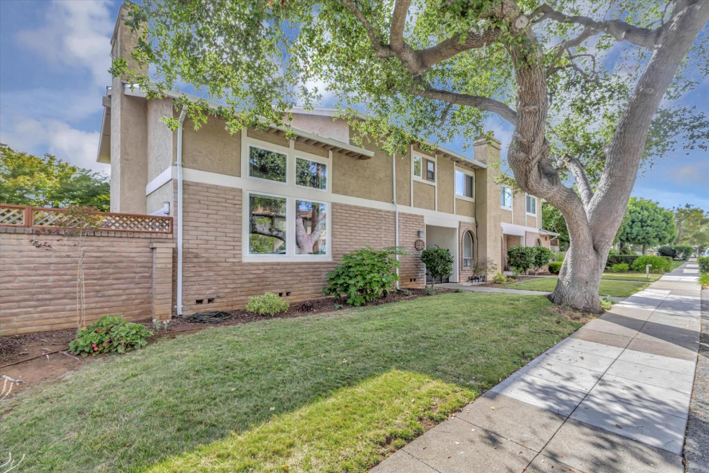 Unique, well maintained TH style condo in a quiet downtown Los Altos neighborhood.  This 3BR, 3BA, 2,024 sq ft unit has dramatic vaulted ceilings in the living room and primary suite w/ multiple large windows that provide an abundance of natural light. Features include a beautiful designer kitchen and separate dining room with custom lighting.  The spacious living room w/ fireplace and dining room open to a quiet, private patio with custom deck, bench, gas firepit, enclosure for TV, and BBQ area. Great for entertaining!  The ground floor includes a remodeled full bathroom and bright bedroom with a sliding glass door leading to a private courtyard. Can also be used as an office or family room. Upstairs features an expansive primary suite with fireplace, private bath, and walk-in closet plus a laundry room and third bedroom w/ ensuite bathroom. New windows and glass doors throughout, central A/C and heat, and large detached 2-car garage. Enjoy all that downtown Los Altos has to offer!