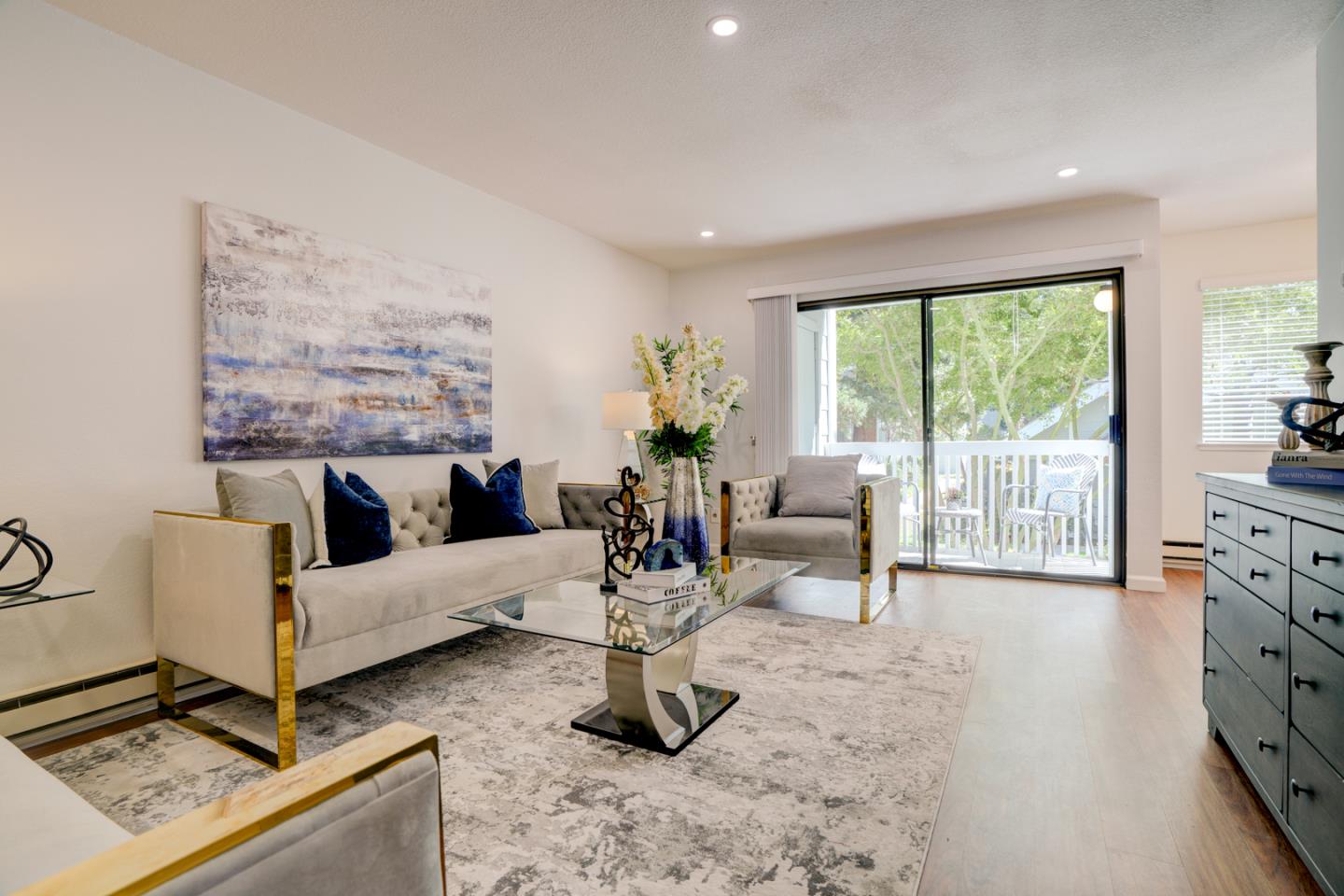 Nested in the west side of Gemello Park neighborhood, this condo is surrounded by Redwoods, Japanese Maples, and Magnolia trees, a truly City Oasis. Freshly painted and tastefully remodeled through out. Kitchen features quartz countertop, newer stainless steel appliances, tray lighted ceiling and a dining area next to the kitchen. Two spacious bedrooms have lots of natural light, as well as a large walk-in primary closet. Bathroom showcases wonderful upgrades, quarts countertop, modern vanity and tile shower/bathtub. Newer washer/dryer and flooring. Living room leads to a private balcony with large storage closet, overlooks a gorgeous Japanese Maple tree and has views of the well maintained clubhouse and pool. Detached oversized one car garage features auto opener.  Amazing location with walking distance to MV Downtown, San Antonio Shopping Center, parks, schools and trail. Minutes away from Google and other Tech companies and easy access to Freeways. Top rated Los Altos school!