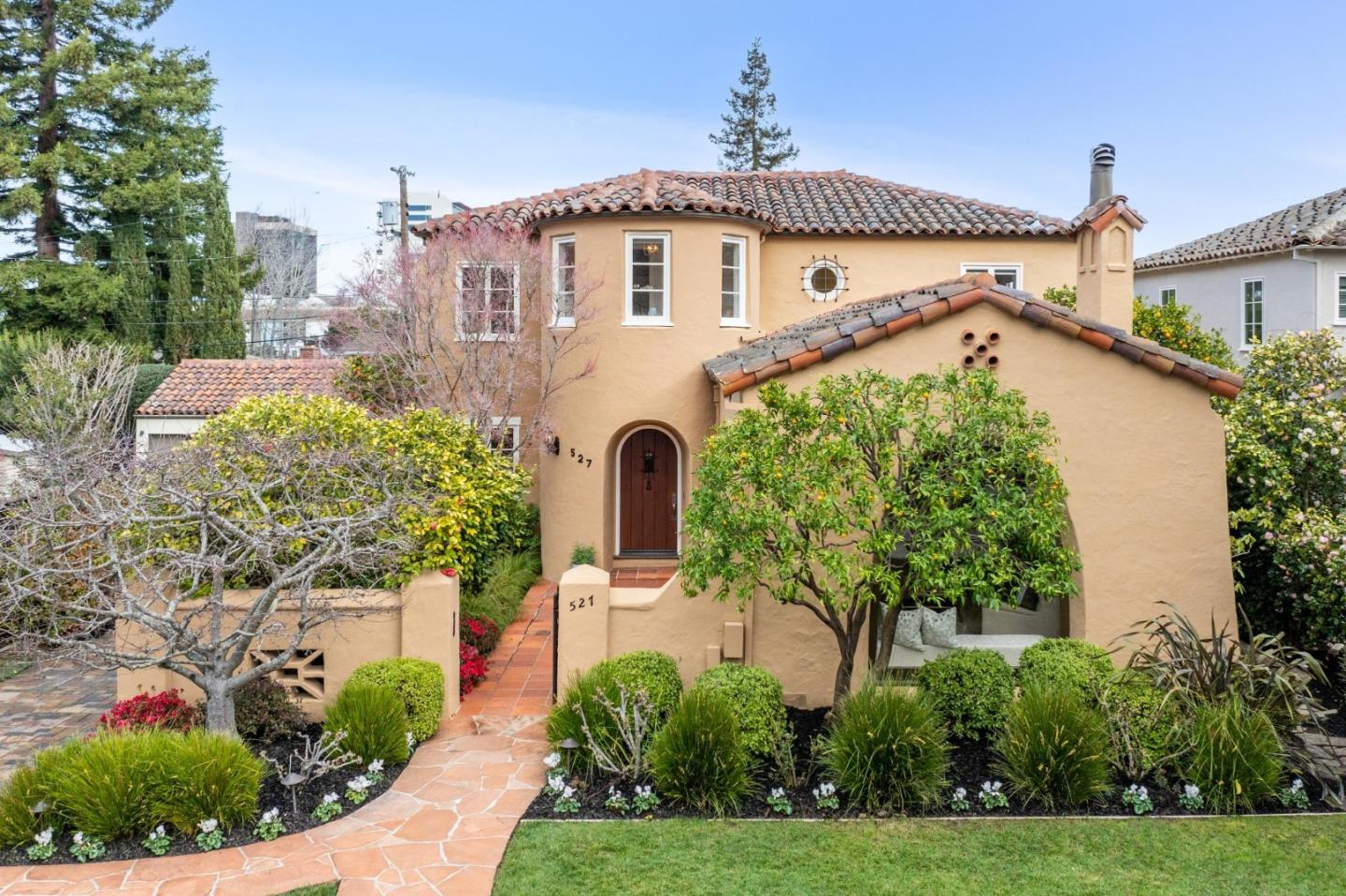 Located in the heart of San Mateo's coveted Baywood neighborhood, this architecturally stunning Spanish-inspired home with a classic stucco exterior, red-tiled roof, and charming courtyard makes an impressive and welcoming first impression. Paying homage to its' 1927 design while being carefully updated with modern conveniences, this home offers four spacious bedrooms and three luxurious bathrooms. In true Spanish style, the gorgeous living room wows with a vaulted and wood-beamed ceiling, arched bay window, wood-burning focal fireplace,  newly refinished hardwood floors, and French doors leading to the idyllic courtyard. The gourmet kitchen is impressive with top-of-the-line appliances, granite counters, custom cabinets, adjoining breakfast room and an adjacent family room. Flowing out through French doors from the kitchen/family room is the private and serene backyard with a spacious heated deck, gas firepit, and professionally designed low-maintenance garden. Completing the 1st level is a formal dining room, bedroom/office and full bath. Three spacious bedrooms on the 2nd level including a Primary Suite retreat. Ideal location just minutes from downtown San Mateo, Central Park, San Mateo Public Library, CalTrain station, Highways 92/101/280, and excellent Baywood schools.
