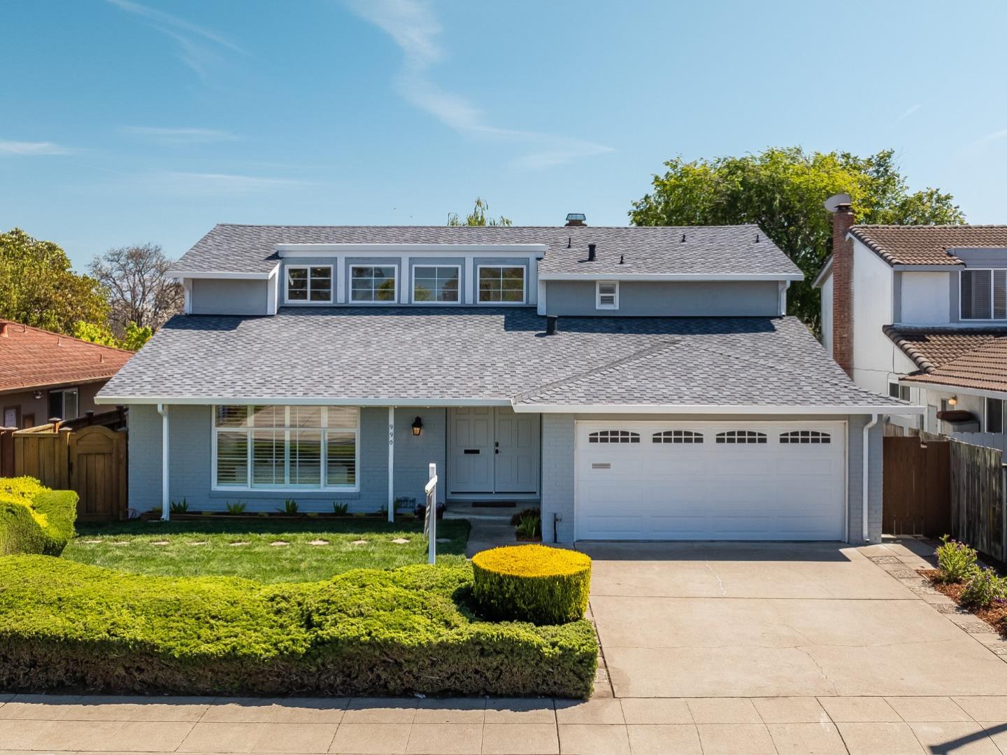 Offering the dazzling convergence of form, function, and transitional style in this completely renovated 5BR/3BA smart home showpiece in Foster City. A grand foyer, impressive half-vaulted ceilings, timeless hardwood floors, brilliant LED recessed lights, plantation shutters, chic motorized shades, and a designer color palette elevate the well-appointed, light-filled floor plan. Experience formal living with contemporary flare in the sprawling front room that elegantly flows to a private dining room. Retreat to the comfortable great room anchored by a mid-century fireplace that overlooks the remodeled kitchen featuring sleek quartz countertops, on-trend cabinetry, stainless steel appliances, and a farmhouse sink. Enjoy utmost versatility with a main-level bedroom and a sizeable full bathroom. Luxuriate in the primary suite, which grants three custom closets and a luxurious bathroom with dual vanities. Three other bedrooms and a hall bathroom also reside on the second level. Thoughtful hardscape gracefully integrates with fresh landscaping to create the optimal outdoor experience. Exquisite upgrades include solar panels, a whole home battery, a newer roof, air conditioning, custom closets, security cameras, and new paint. Walkable to the Bay Trail, parks, and top-rated schools!