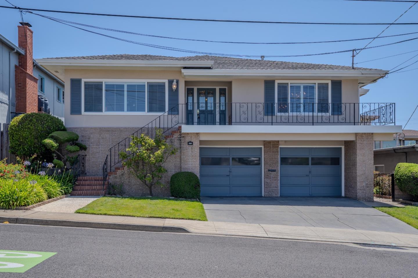 Expansive views from this amazing 3900 +/- Square Foot Custom Built Home. Located in the esteemed Park/Rocca are of SSF, it functions as a very spacious single family home with 4 bedrooms and 3 baths with 3 separate living/family rooms. Alternatively the downstairs could be a full separate apartment. Pride of Ownership shine in the home owned by only one family. You will be wowed as soon as you pull up to this majestic home overlooking South San Francisco and see the expansive views from the wrap around porch. Enter into the a large formal entry flanked by a formal living room and a separate formal dining room. As you move through the home you will find beautiful hardwood floors in the remodel kitchen with granite countertops and SS appliances. There is a informal dining area off the kitchen with a enormous gathering room with a fireplace and wet bar. Also, a conveniently located laundry room off of this space. There are 3 large bedrooms and 2 baths on the upper floor. Downstairs functions as a extra roomy second unit. A large living room with a second fireplace, a full kitchen, large remodeled bathroom and a generous bedroom.  There is an enormous garage and a separate workshop.  The backyard is wonderful oasis. Beautifully landscaped. This hom