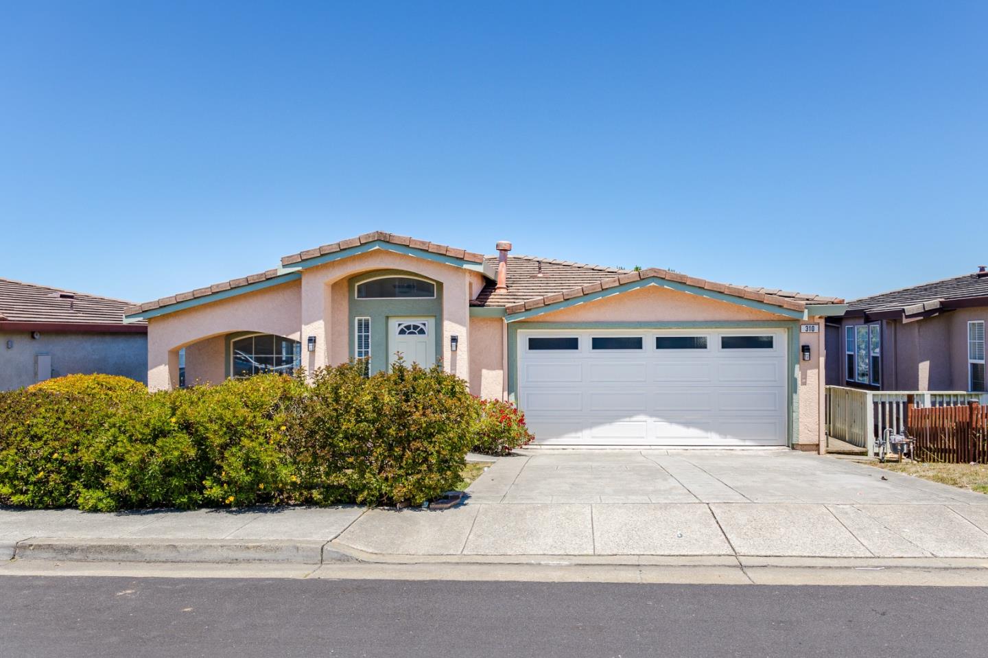 Welcome to 310 Goodwin Dr in the sought-after Portola Highlands! This meticulously maintained 4-bed, 2.5-bath home offers 2,500 sqft of elegant living space, boasting numerous upgrades. Beautiful hardwood floors extend throughout, adding warmth & sophistication. The open kitchen ft tile floors, brand-new microwave, and a kitchen island with a cooktop; seamlessly connecting the family room for easy entertaining. The primary en-suite bedroom offers cozy fireplace, large sunken tub, stall shower & walk-in closet. Each of the 3 spacious guest bedrooms ensures comfort for family and visitors. Modern amenities include a washer/dryer, updated auto garage door, upgraded water heater, luxury blinds, new exterior lights, fresh interior paint, and new light fixtures throughout. The separate laundry room has plenty of cabinets; ample storage. The home features a 2-car garage. Two private balconies offer unobstructed views of the neighborhood, city, and Bay, perfect for enjoying a morning coffee or evening sunset. Conveniently located close to Lunardi's, short drive to I-280 for quick access to SF and Silicon Valley. Nearby parks & Skyline College provide excellent options for outdoor activities. This home is a perfect blend of luxury, comfort, and convenience, set in a prestigious location!