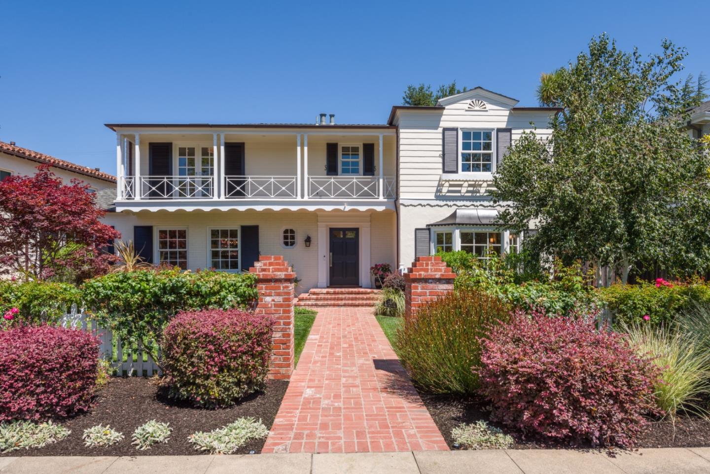 Don't miss this beautifully updated Monterey Colonial, built in 1936 and featuring modern enhancements for today's lifestyle. The property boasts a newer roof, gutters, windows, garage door and updated electrical.  Inside, you'll find generously sized rooms with a layout that includes 3 bedrooms and 2 baths upstairs, and 1 bedroom and 1 bath downstairs. The primary suite includes a sunroom/office area, providing a cozy space for work or relaxation.  The bright and cheery kitchen features a farmers sink, granite counters, high end appliances and a breakfast nook.  The large family room opens to a spacious backyard, ideal for entertaining.  The living room features high ceilings, a gas fireplace and French doors with garden views.  Located in the desirable Baywood neighborhood, this home offers convenient access to downtown San Mateo, public transportation, HWYS 101, 280 and 92 and excellent local schools.