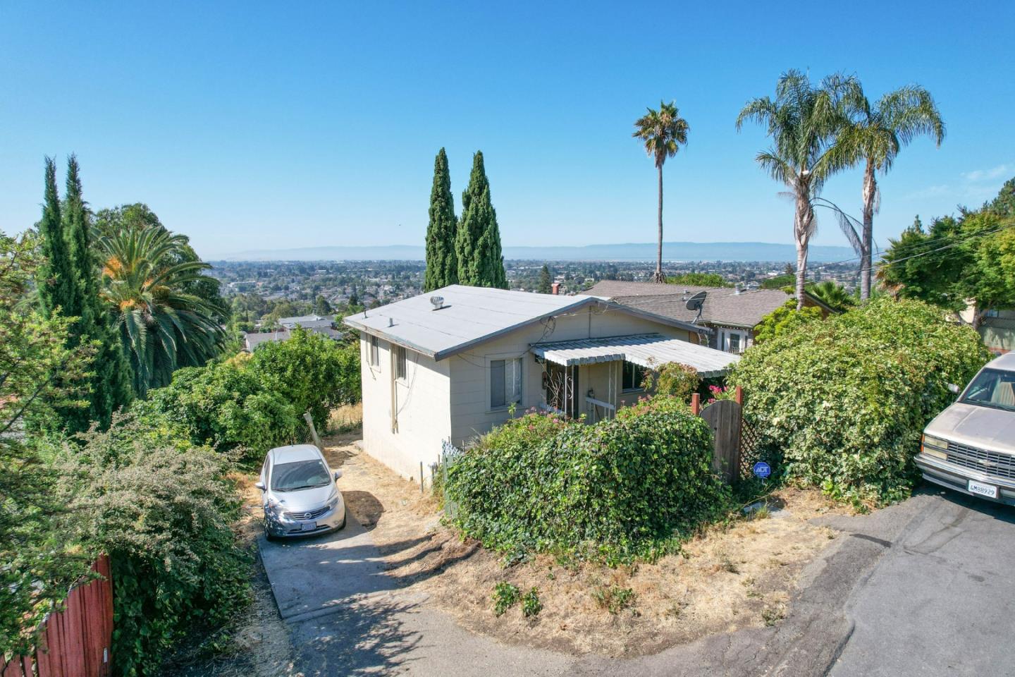 Build out your dream home on this amazing property in the San Leandro Hills! With sweeping views of the city below, this property is ideal for building out a deck and enjoying your morning coffee or an evening around the fire. Located close to Hillcrest Knolls Park and Lake Chabot Regional Park, there are many outdoor adventures and hiking trails to explore. This home is surrounded by lush greenery with enough space to create your own fantasy garden. There is also a basement space that can be renovated into another bedroom and bathroom as well. The property is a fixer upper so your options are endless. Don't miss out on an amazing opportunity to create your ideal home!!