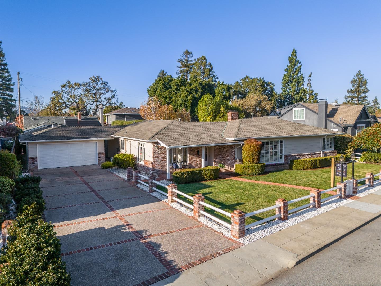 Set on an expansive 11,100sf lot in the ever popular White Oaks neighborhood, this 2,670sf single level home is the one you've been waiting for! Enjoy the sun-filled living room with vaulted open beamed ceilings, fireplace & newly refinished wood floors! Updated kitchen with new cooktop, granite counters & white shaker cabinet and breakfast nook. Formal dining room with plantation shutters. XL family room open beam ceiling & new carpet opens to the spacious sunroom the looks to the backyard retreat!  3 spacious bedrooms, includes 2 ensuites + additional office/library.  Detached 2-car garage features a new garage door and bonus room for tons of storage!  The professionally landscaped yard offers the quintessential California outdoor living experience, dine under the stars or sip your morning coffee on the patios overlooking the pool! Additional highlights include fresh paint inside & out, newly refinished wood floors, new carpet, plantation shutters & more!  Walk to top-rated White Oaks School!  San Carlos ~ The City of Good Living! Offering a charming downtown with fine dining, boutiques, coffee shops, parks, library, community center & CalTrain. Conveniently close to Snowflake, Google, Box, Meta, Oracle, Stanford & more! Convenient to SF & Silicon Valley.