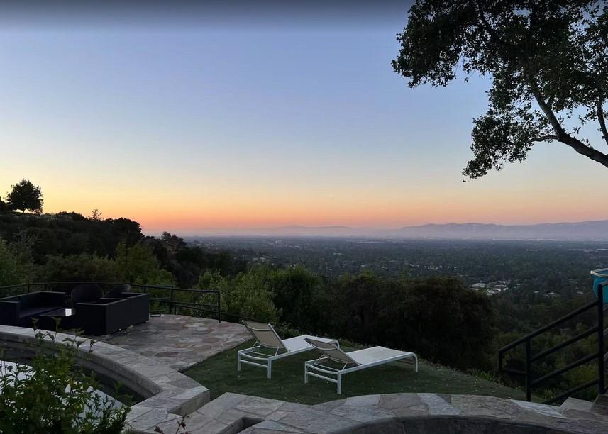 Prepare to be captivated by this extraordinary 5,500 sqft estate,set on a sprawling 13.2-acre parcel in the prestigious Saratoga Hills.Offering spellbinding panoramic views of Silicon Valley & the San Francisco Bay.Currently in the process of subdivided into three lots (10 acres, 2 acres, and 1.5 acres),this remodeled 5-bedroom, 5.5-bath contemporary masterpiece is a mere 1.25 miles from Saratoga Village.Seamlessly blending luxury & sophistication,the home features a grand double-door entry & soaring ceilings that set the stage for an impressive interior adorned with custom moldings,mahogany accents,& a harmonious mix of hardwood & travertine floors.The heart of this residence is the gourmet chef's kitchen,boasting top-rated stainless steel appliances,a massive granite island, custom cabinetry.Entertainment options abound with a spacious game room,full wet bar,state-of-the-art media room/home theater,wine cellar,a 90-bottle wine closet.The opulent master suite features a fireplace & breathtaking views,while the outdoor oasis showcases a sparkling pebble-bottom pool & spa surrounded by lush,mature landscaping.Additional amenities include floor-to-ceiling windows,central air conditioning,a central vacuum system & two offices, this property epitomizes Silicon Valley luxury living.