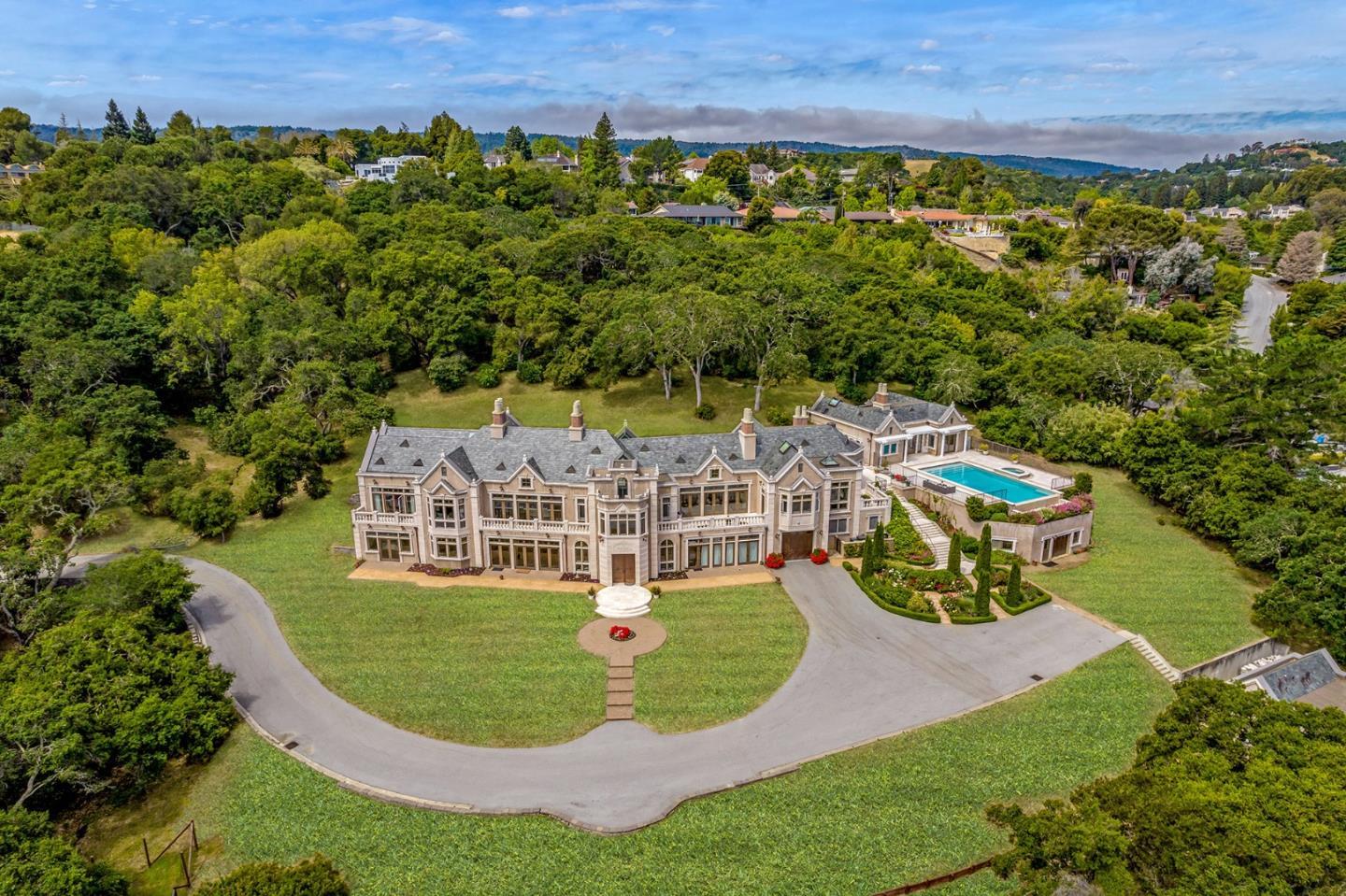 Extraordinary residence with stunning panoramic San Francisco Bay views. Opulence and European inspiration at every turn. Impeccably crafted by renowned builder Markay Johnson in 2014 on a private gated lane with gated driveway. Lavish beauty throughout the home with hand-selected marble from Milan, elaborate millwork, Doric columns, intricate carvings, and gilded details. All-marble staircase with hand-forged railings leads to the upper level with formal living room, formal dining room, tremendous kitchen, family room, office, plus grand primary suite with 2 full baths. 3 luxurious bedroom suites plus large office and conference center make up the ground level. Breathtaking views from every room on both levels. Elevator in the main residence. 1-bedroom pool house and studio guest house, each with bath and full kitchen. Sparkling pool and spa plus fireplace terrace for idyllic entertaining in complete privacy. Set on a large estate lot.