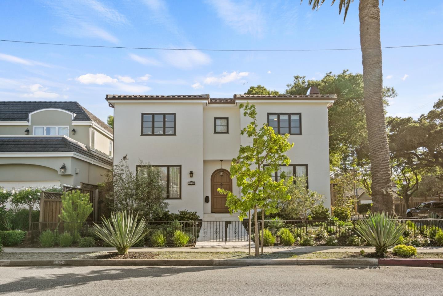 Elegant Spanish Colonial Revival style home, where timeless elegance meets modern high-tech innovation, on a large corner lot in the sought-after Easton Addition area of Burlingame. Meticulous attention to detail & interior design, artfully rendered by the prestigious firms of Kari McIntosh Design & FORMA Construction, adorn every graceful feature including vaulted ceilings, framed windows, hardwood floors, crown molding, decorative sconces, & stunning chandeliers overhead.  Enhanced by user-friendly smart features for climate control, automated fireplaces, recessed lighting, window treatments & more.  Formal entertaining spaces highlighted by the gorgeous living room & glamorous dining room, uniquely enveloped by exquisite Silver Silhouette hand painted wallpaper, created via Charles R Gracie & Sons, New York. Gourmet chef's kitchen, with Wolf & Sub-Zero stainless appliances, temperature monitored wine fridge, expansive countertops, artisan tile backsplashes, & full-length cabinetry compliment the casual eat-in kitchen & great room area that opens onto the spacious outdoor patio overlooking landscaped greenery & flowering garden, European style wall fountain, & beautiful live oak trees. This singularly one-of-a kind home is Luxury Peninsula living at its most gracefully refined.