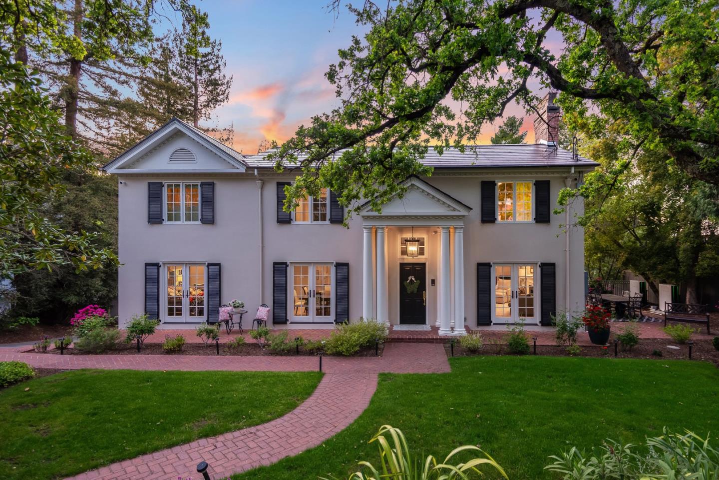 Welcome to 455 Upland Road, where timeless elegance meets everyday luxury in Redwood City's coveted Emerald Hills. Set on a tranquil hillside, this fully renovated Georgian-style estate offers 5 bedrooms, 4 baths, an office, and over 4,600 sq ft of refined living across three levels. Enter through a private gated drive to beautifully landscaped grounds. Inside, a gracious foyer leads to light-filled formal spaces, wide plank white oak floors, custom cabinetry, and bespoke details that exude sophistication. The chef's kitchen pairs sleek Dekton countertops with top-tier appliances, including a 60" Wolf range, Sub-Zero refrigerator, Bosch dishwasher, and Fisher & Paykel dish drawers -- all opening to a spacious deck for seamless indoor-outdoor living. The luxurious primary suite features its own lounge, dual-sided fireplace, walk-in closet, and spa-like bathroom. The lower level offers a full media room and game room plus a guest suite with ensuite bathroom. Smart home tech, solar power, EV charging, and a versatile workshop add comfort and innovation. From the graceful symmetry of its Georgian roots to the sleek, modern touches within, this is a rare opportunity to own a residence that is as intelligent as it is elegant.