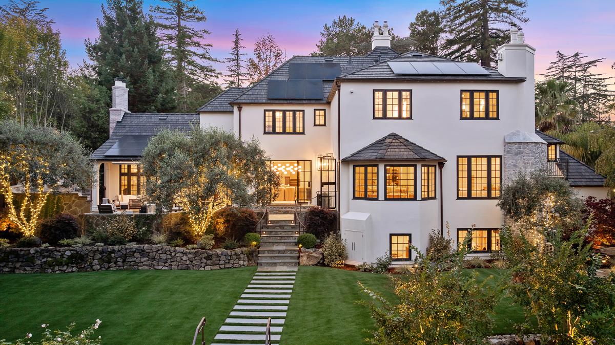 Tucked in one of South Hillsborough's most coveted enclaves, this private gated estate blends timeless design with fresh, modern updates across an expansive floor plan. A grand motor court and curated landscaping with mature trees and hundreds of new plantings set an impressive tone on arrival. Inside, the heart of the home features an architectural chef's kitchen and great room with soaring ceilings and walls of glass that open to the outdoors. Formal living and dining rooms create an elegant setting for entertaining, while a stunning office with floor-to-ceiling windows provides the perfect workspace. Five luxurious en-suite bedrooms and seven-and-a-half beautifully designed bathrooms with spa-like amenities like a soaking tub and a steam shower. Additional highlights include four fireplaces inside the home, dual laundry rooms, a versatile media room and gym, and modern upgrades such as new electrical systems, EV charging, and dual HVAC. Outside, the resort-style grounds offer a pool, jacuzzi and cabana, water features, an outdoor kitchen, and an outdoor patio fireplace. Located close to top schools, downtown Burlingame, and easy commuter routes, this exceptional property delivers both everyday comfort and extraordinary style.