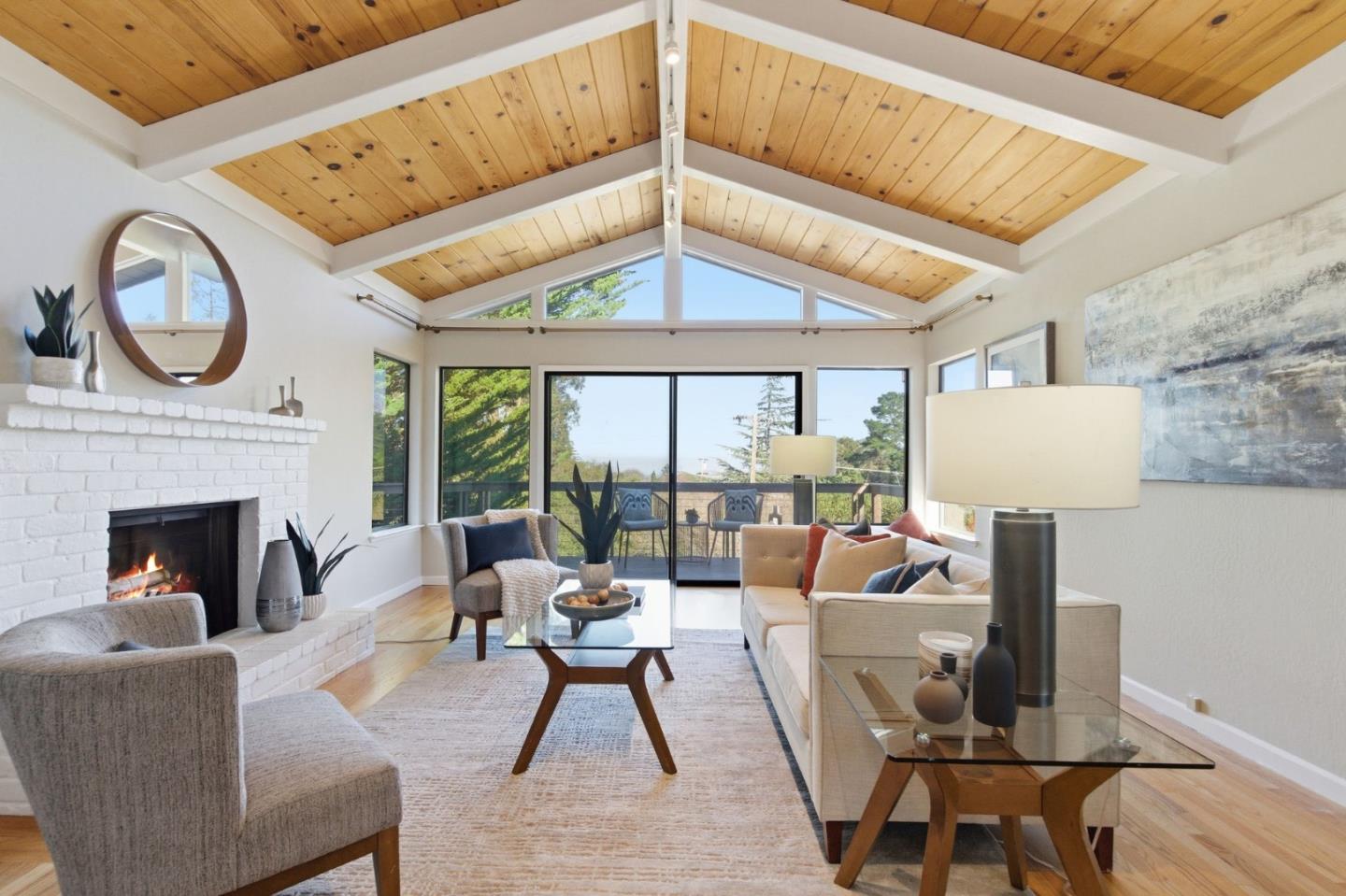 A perfectly idyllic setting for this beautifully remodeled home in the heart of Belmont. Surrounded by mature trees and views of the San Francisco Bay, this stunning home is not to be missed and must be seen in person to be truly appreciated. The home features four bedrooms, two and one-half bathrooms, a living room with soaring ceilings which showcase direct bay views, a great room with a full chef's kitchen and so much more. Glass sliding doors and oversized windows allow for an abundance of natural light at all times of the day. The backyard features a spacious wrap-around deck, a pathway to a secluded area with a fire pit and a perfectly manicured landscape. This very special property is assigned to the very best schools, including Carlmont High School. Please consider joining us at one of our open houses on Saturday and Sunday, January 17th and 18th from 1:30-4:00 pm, both days. A complete disclosure package is available upon request.