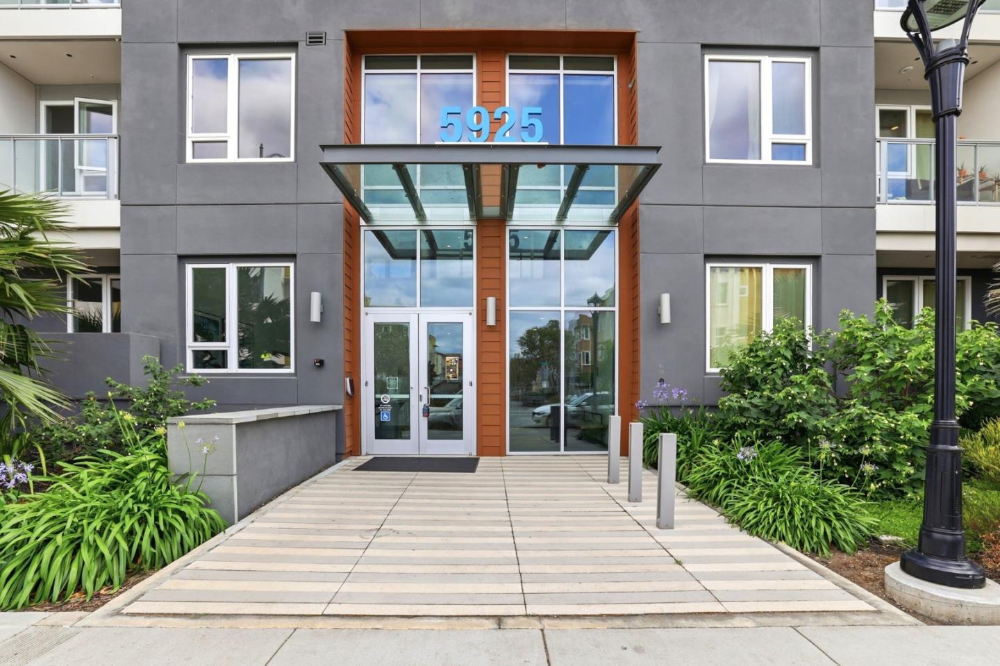 Great opportunity to own a modern residence that still feels like a brand-new home. As a top-floor corner unit, it offers no overhead neighbors and only one shared wall. It features two bedrooms with walk-in closets plus a spacious den - perfect for a home office, playroom, guest room, or dining area. The interior is bathed in natural light from south-facing windows and boasts high ceilings, recessed lighting, and waterproof luxury vinyl flooring. A chef's kitchen serves as the heart of the home, with plenty of white shaker cabinetry, soft-close drawers, a backsplash, SS appliances, and a huge quartz island. This tech-forward sanctuary features CAT-6A wiring, smart controls for lighting, climate, and doorbell, plus app-managed building access for guests. Freshly painted, professionally cleaned, and entirely turn-key! Beyond the front door, enjoy resort-style amenities including a sparkling pool, spa, gym, yoga room, outdoor BBQs, and conference area. A luxury clubhouse with a fireplace & lounge can be reserved for private events. 2 assigned parking spaces close to the elevator. EV charging & a bike room are available on-site. Located near Costco, Kaiser, library, and sports fields. Walking distance to a dog park, dining, and shops. Easy access to major Hwys 85/101 & VTA station.
