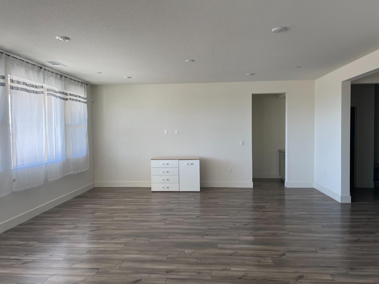 Welcome to the Aviano Community! This energy efficient, single-story home built in 2023 is ideally situated next to Bay Miwok Meadows Park. Offering 4 bedrooms and 2.5 bathrooms across 2,330 sqft, this modern residence combines comfort, style, and convenience. The kitchen features a sleek quartz island and countertops, a full covered tile backsplash, stainless steel appliances, and contemporary cabinetry. The oversized family room showcases a bright, open floor plan perfect for entertaining or everyday living. The primary suite includes a spacious bathroom with a large double sink vanity, soaking tub, glass enclosed shower, and an expansive walk-in closet. Laminate wood flooring flows through the main living areas, while plush carpet adds comfort to the bedrooms. A dedicated laundry room with extra cabinetry provides additional storage. Additional highlights: PAID SOLAR, Ring doorbell, Refrigerator, Washer, and Dryer, Microwave, Gas Oven/Range, Dishwasher all included. Located in the desirable Aviano Community near Kaiser, Costco, schools, shopping, and just minutes from BART and freeway access. This beautiful home is truly move-in ready. Come see it today!