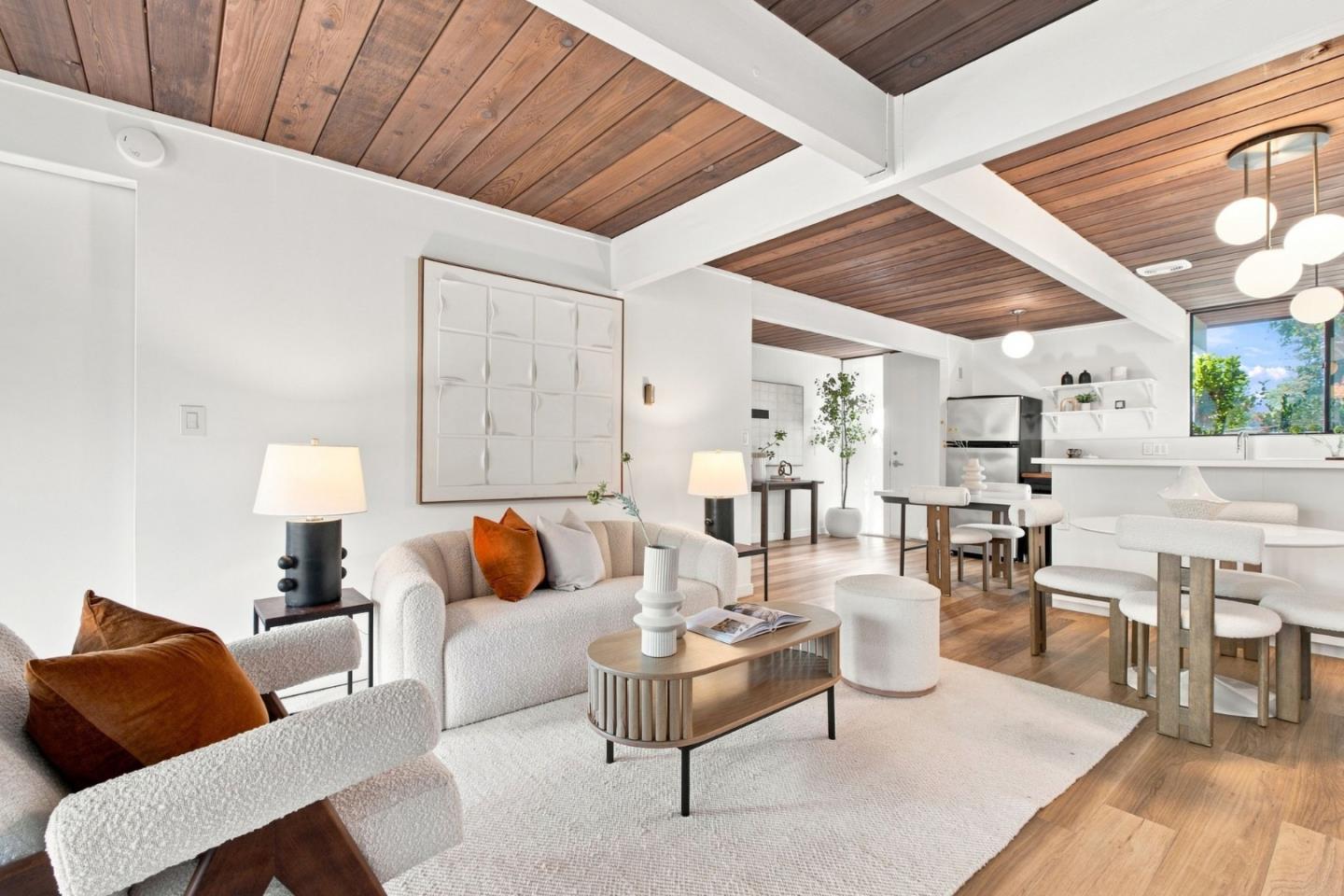 Mid century modern Eichler show-peice with effortless indoor outdoor living come together at 131 Greenmeadow Way in Palo Alto's Meadowcreek community featuring one-level townhome style living. Warm wood paneled ceilings, exposed beams and hardwood floors bring architectural character throughout the open living and dining spaces, while expansive windows and glass doors fill the home with natural light. The kitchen opens to the dining and living areas, creating an easy flow for everyday living and entertaining. A distinctive fireplace anchors the living room, with walls of glass opening directly to a private patio and garden for a seamless connection outdoors. Signature sliding doors, including moving wall which allows you to define the spaces in the way most fitting your lifestyle. The community pool adds another inviting space to relax and enjoy the California lifestyle. Ideally located near parks, Caltrain, Stanford, Stanford Shopping Center and Downtown Palo Alto, with convenient access to El Camino Real and Highway 101 and connections to Mountain View, Los Altos and destinations throughout the Peninsula.  Enjoy being just moments from popular Mitchell and Ramos Parks, Charleston Shopping Center, and all things Silicon Valley.